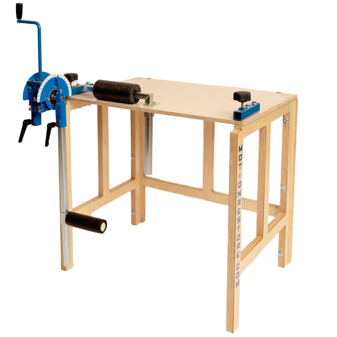 Woodworking bench with vise and roller stands.